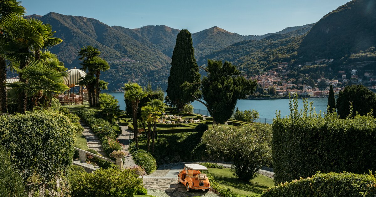 A golf cart and lush green grounds at Passalcqua.