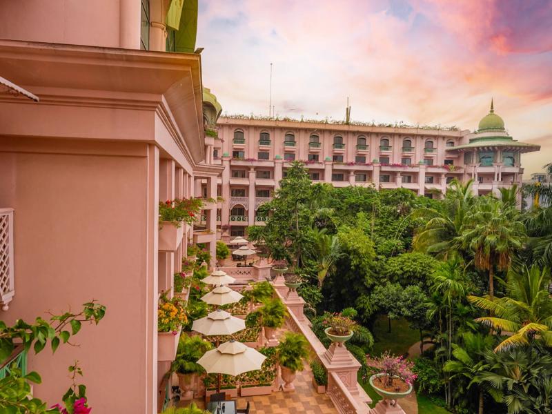 The Leela Palace Bengaluru terrace suite exterior with lush garden views and elegant architectural details