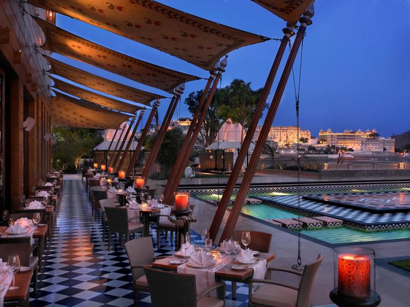 The Leela Palace Udaipur alfresco dining terrace overlooking Lake Pichola at sunset